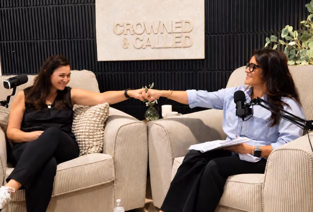 Melinda and Angie sharing a fist bump in the Crowned and Called recording studio